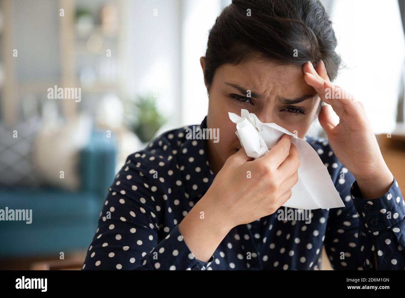 Indian woman blowing nose handkerchief hires stock photography and