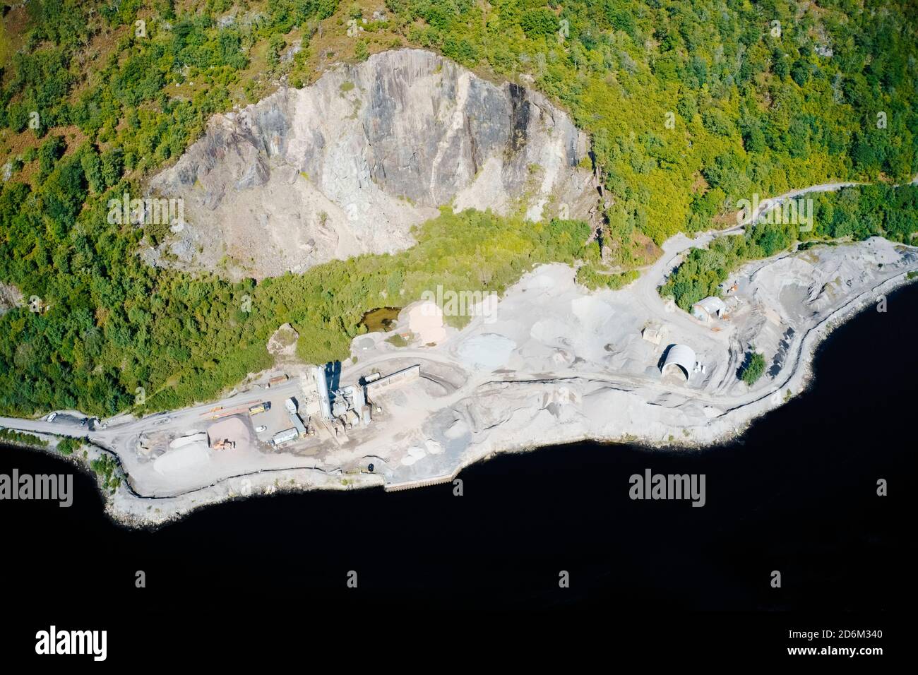 Quarry works industrial digging aerial view from above showing sand mound and hills Stock Photo