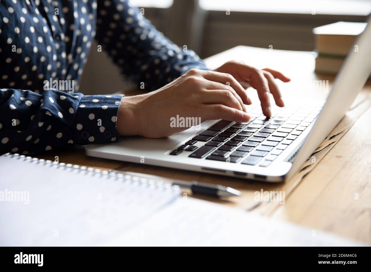 Close up view image female hands typing on laptop keyboard Stock Photo