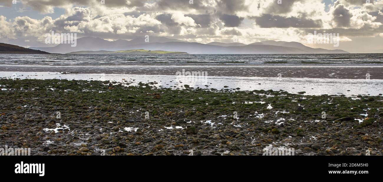 September and a dramatic sky frames the view looking south west from the shore at Ettrick Bay on Bute Stock Photo