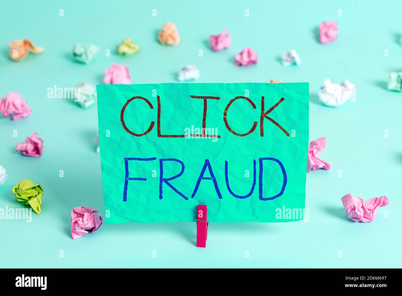 Handwriting text writing Click Fraud. Conceptual photo practice of repeatedly clicking on advertisement hosted website Colored crumpled rectangle shap Stock Photo