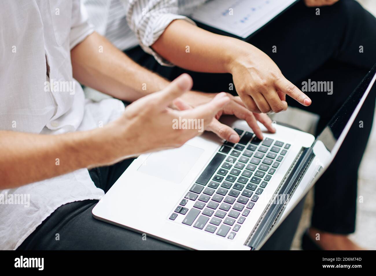 Analyzing data on screen Stock Photo