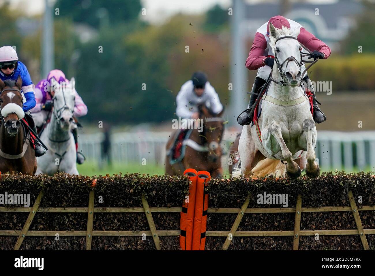 Silver Streak ridden by Tom O'Brien (right) goes on to win The Racing TV Hurdle at Kempton Park Racecourse. Stock Photo