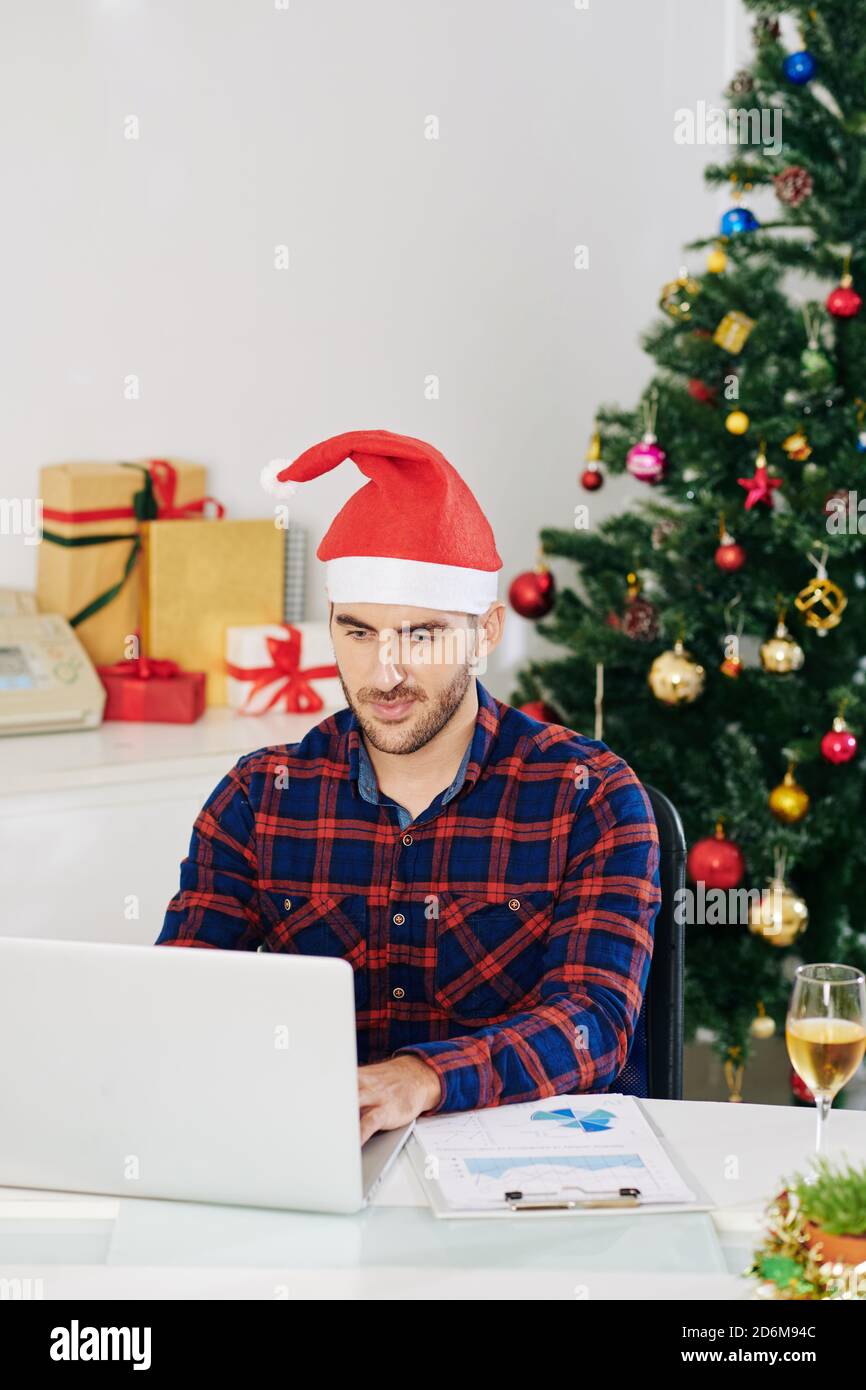 Working in office on Christmas Stock Photo