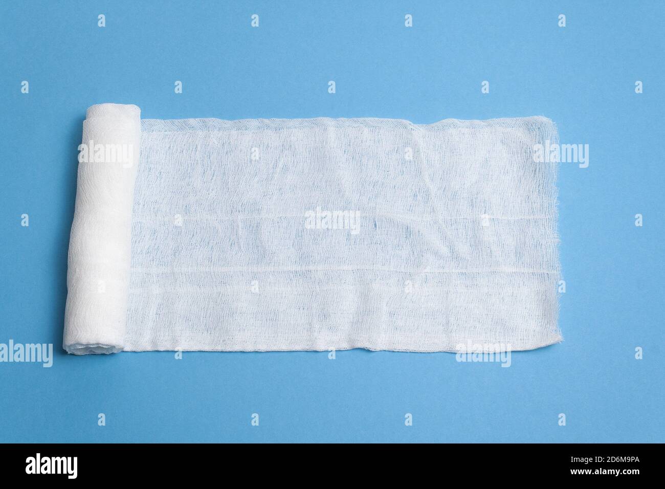 Gauze bandage on a blue background with blank space for text