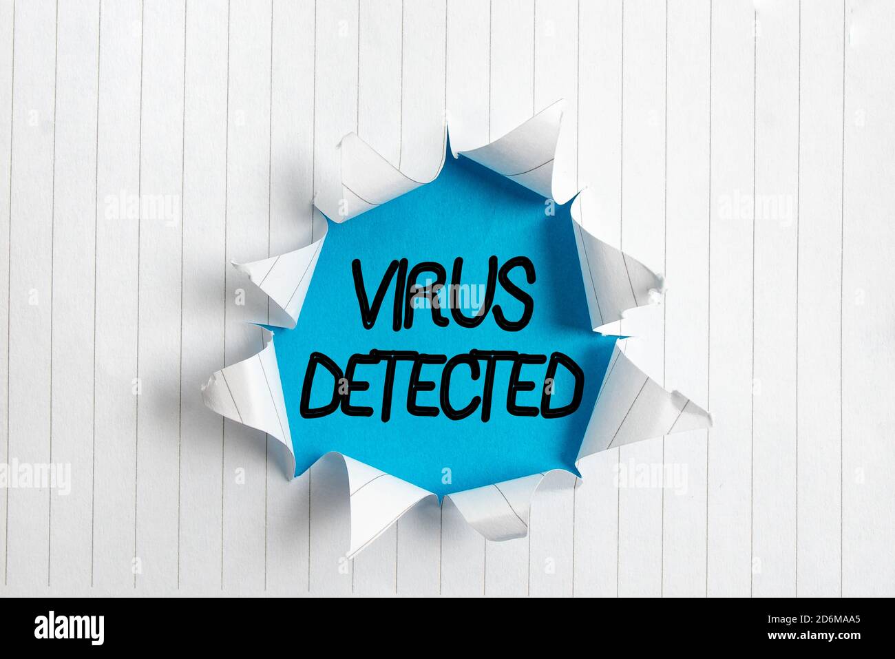 Writing note showing Virus Detected. Business concept for a computer program used to prevent and remove malware Rolled ripped torn cardboard above a w Stock Photo