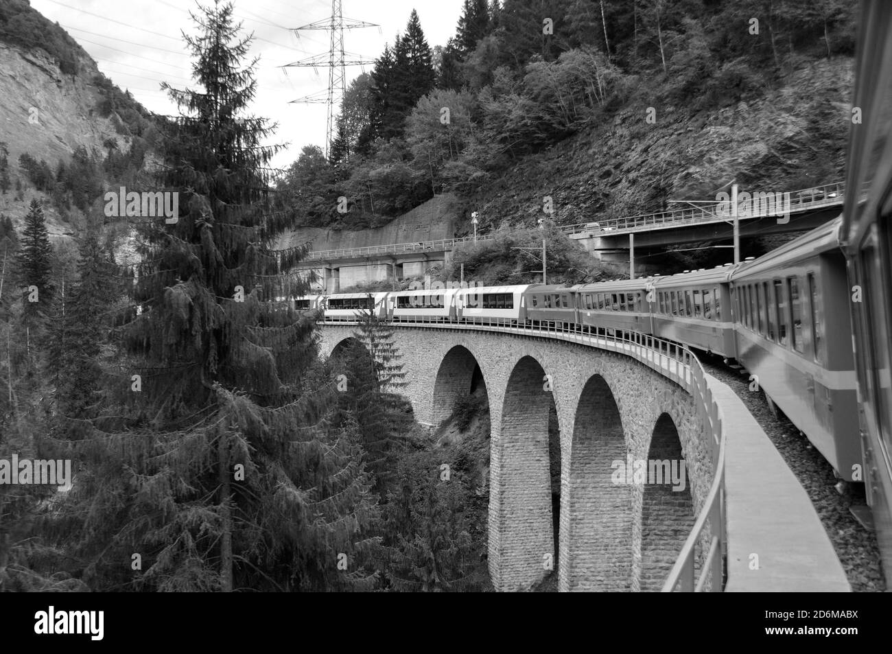 The glacier Express train is driving across the swiss alps and through