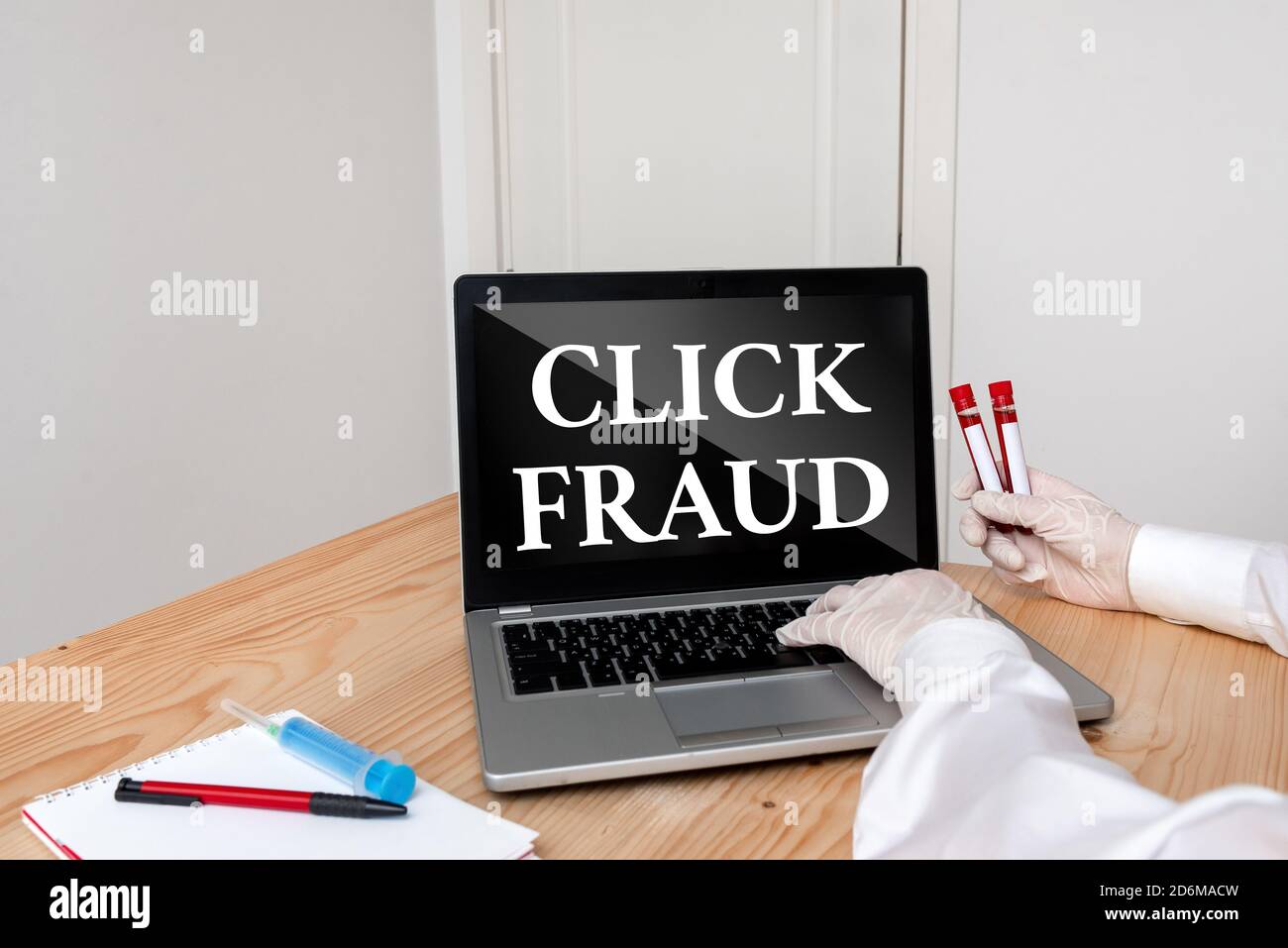 Writing note showing Click Fraud. Business concept for practice of repeatedly clicking on advertisement hosted website Blood sample vial lastest techn Stock Photo