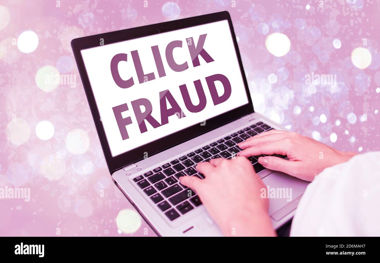 Text sign showing Click Fraud. Business photo text practice of repeatedly clicking on advertisement hosted website Modern gadgets with white display s Stock Photo