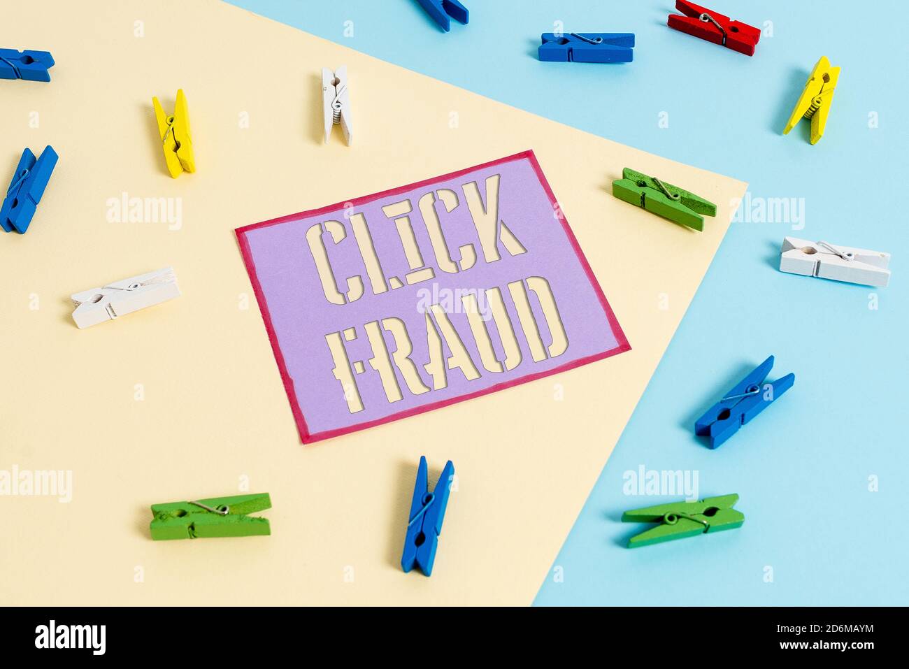 Handwriting text Click Fraud. Conceptual photo practice of repeatedly clicking on advertisement hosted website Colored clothespin paper empty reminder Stock Photo