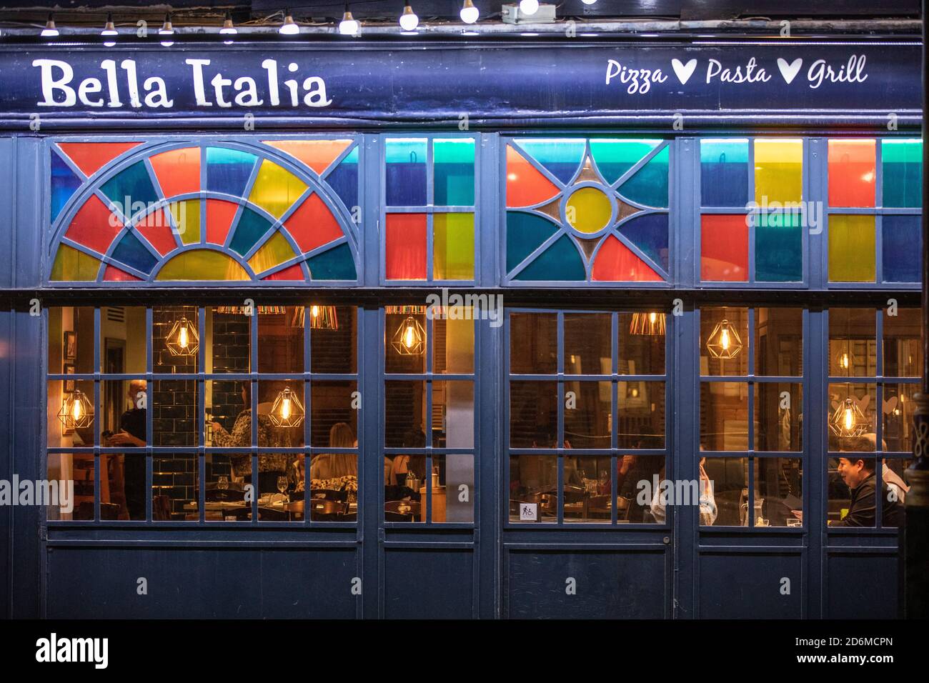 Half empty Bella Italia restaurant in the heart of Covent Garden as the latest Tier 2 lockdown restrictions are enforced across London, England, UK Stock Photo