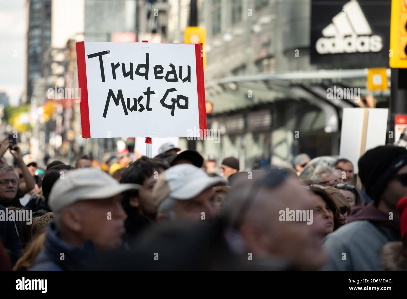 Protesters express dislike for Prime Minister Justin Trudeau at the 'March for Freedom' from COVID-19 restrictions in Toronto, Canada. Stock Photo