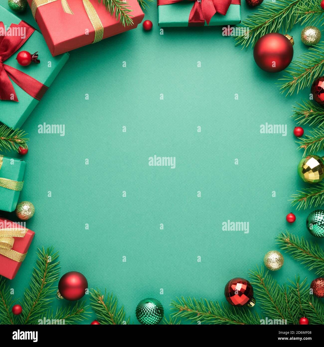 Christmas card with circle frame on turquoise background. Blank with copy space for advertising text. Top view, flat lay Stock Photo