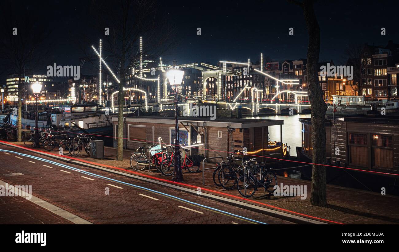 Amsterdam, Netherlands, January 6, 2020: The Magere Bridge over the river Amstel with disruptive light elements in front of the bridge during the Ligh Stock Photo