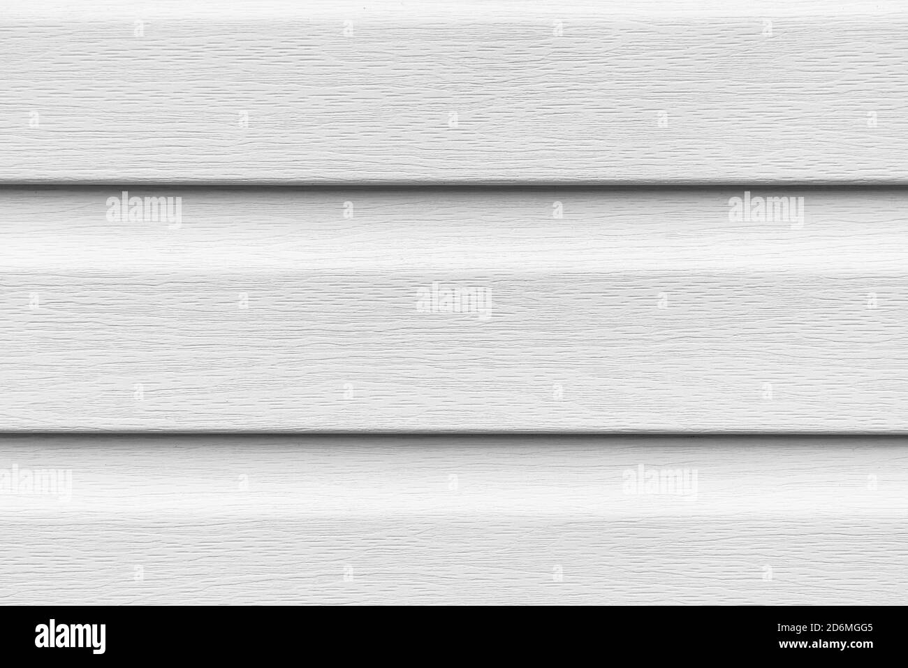 Construction vinyl siding panels pattern. House covered with white