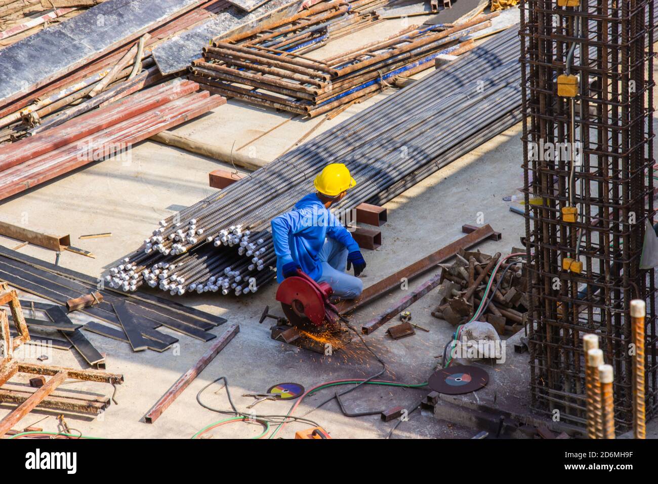 Worker use electric industrial steel cutting machine work in area