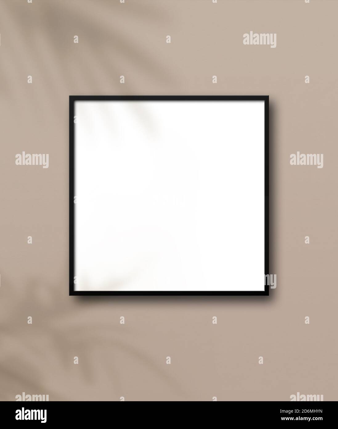 Black square picture frame hanging on a light beige wall. Floral ...