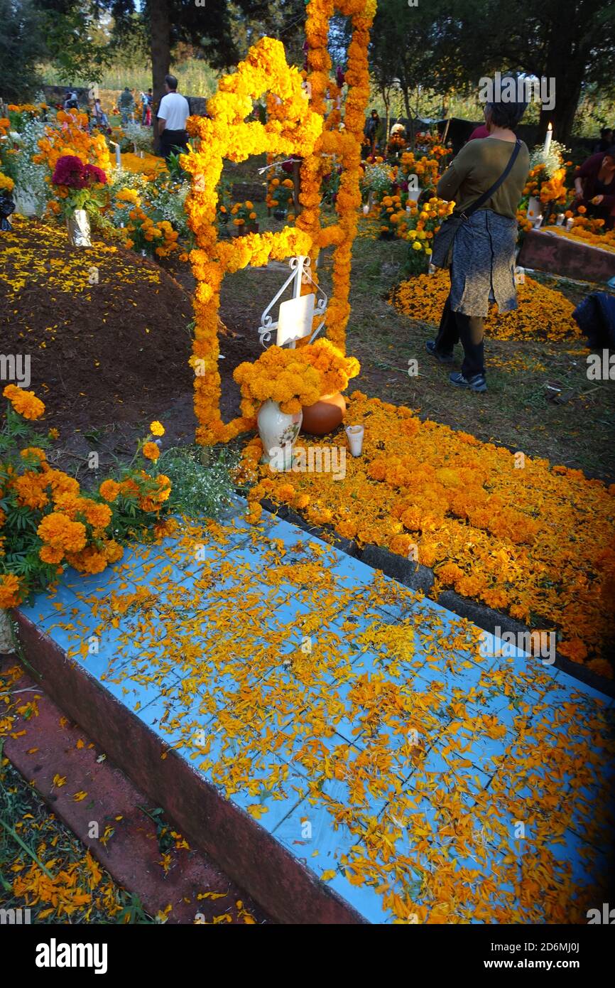 Marigolds known in Mexico, as "the flower of the dead" decorate graves in Patzcuaro during Day