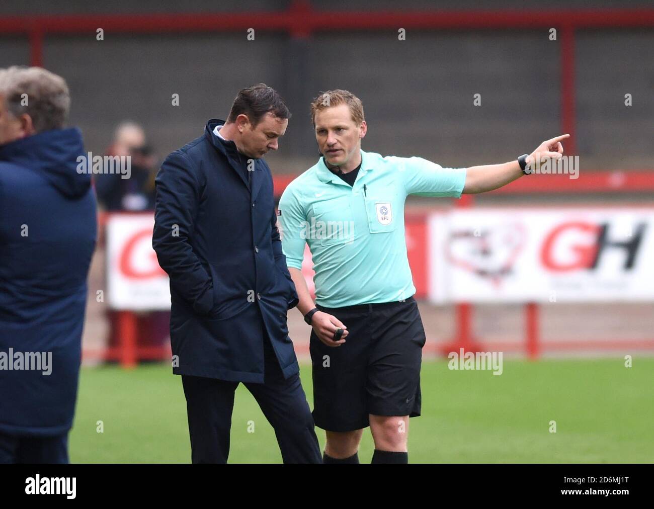 Referee John Busby with Morecambe manager Derek Adams during the League Two match between Crawley Town and Morecambe at the People's Pension Stadium  , Crawley ,  UK - 17th October 2020 - Editorial use only. No merchandising. For Football images FA and Premier League restrictions apply inc. no internet/mobile usage without FAPL license - for details contact Football Dataco Stock Photo