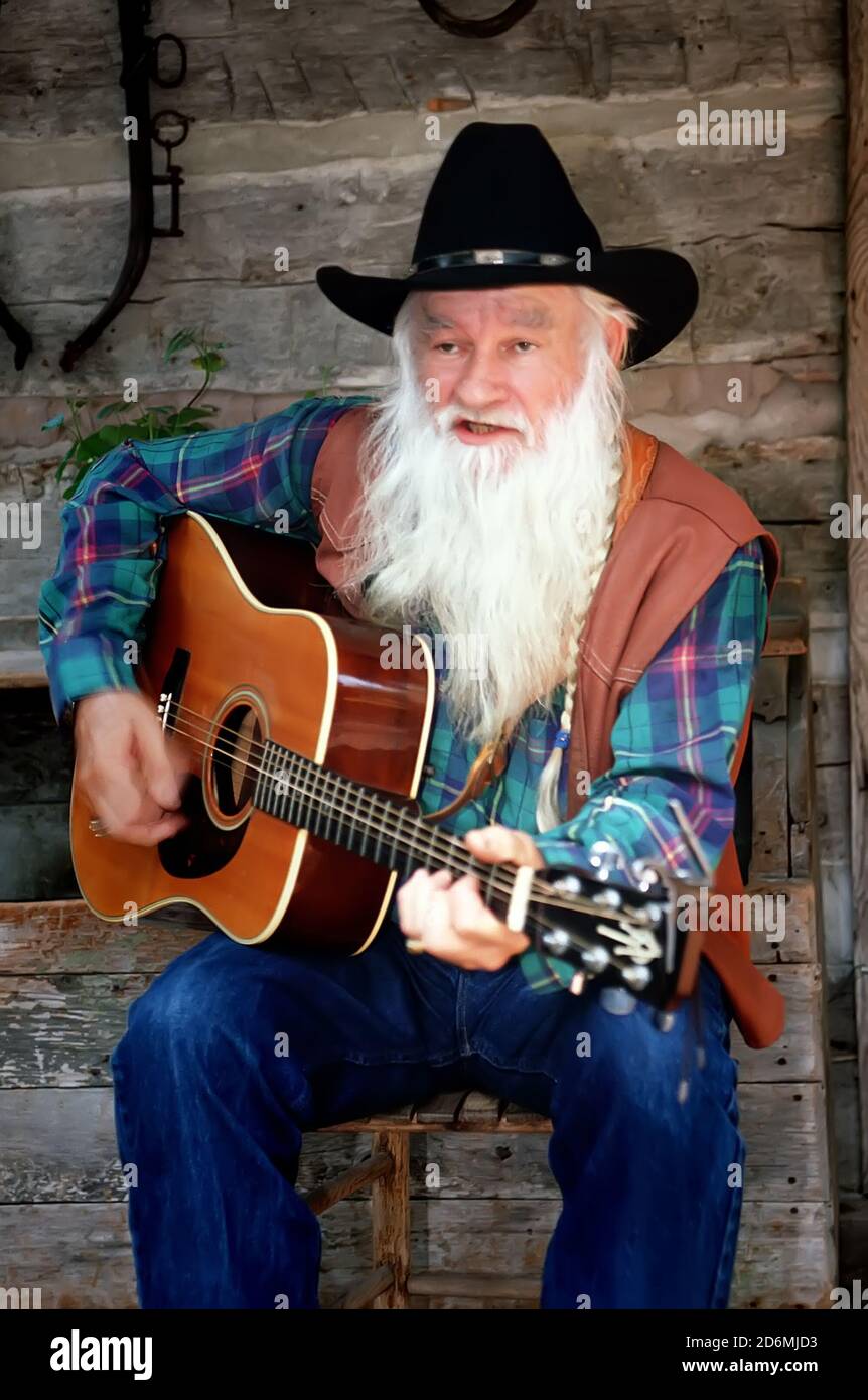 Old man guitar cowboy hi-res stock photography and images - Alamy