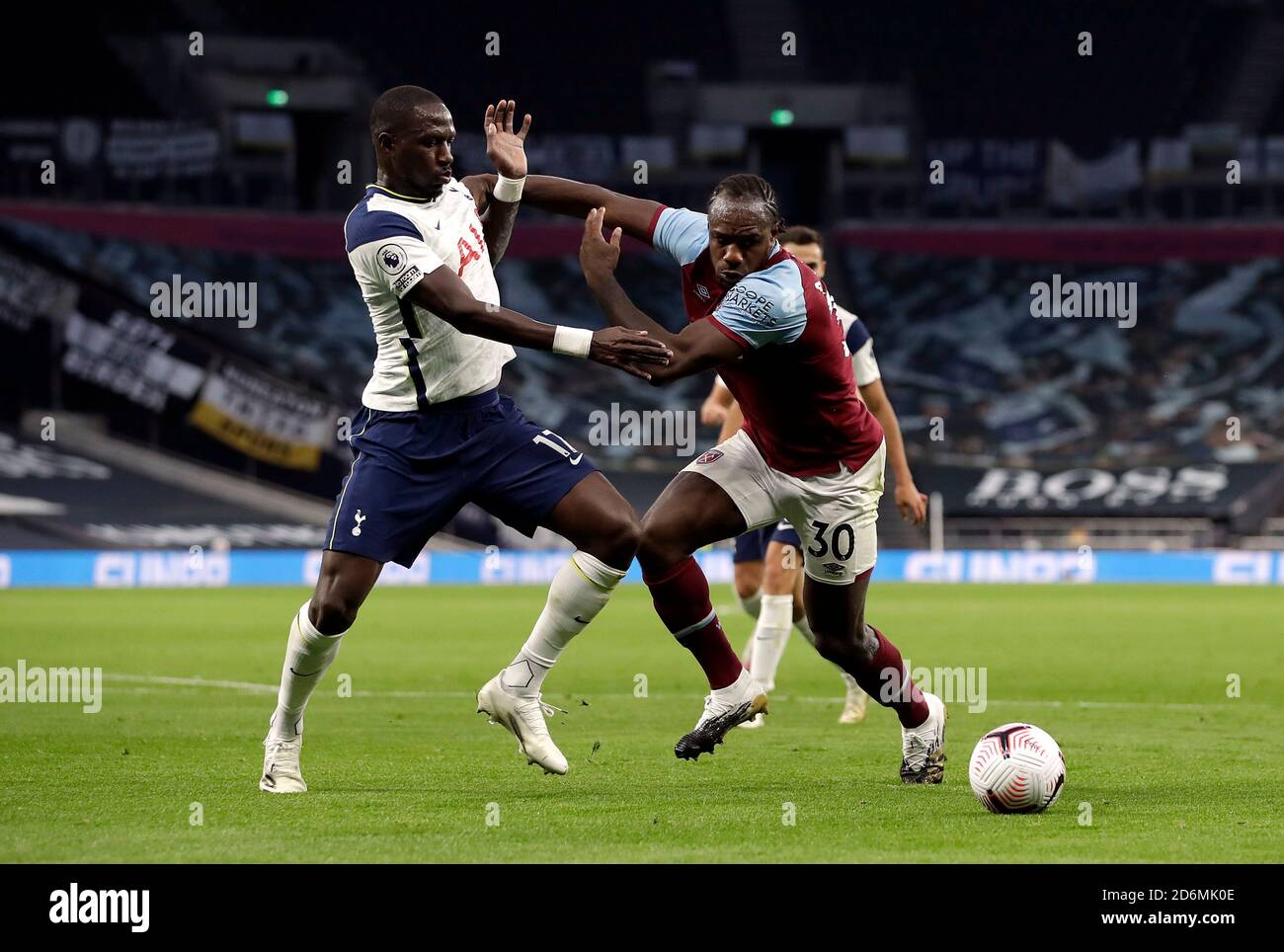 Tottenham Hotspur's Moussa Sissoko (left) and West Ham United's Michail Antonio battle for the ball during the Premier League match at Tottenham Hotspur Stadium, London. Stock Photo