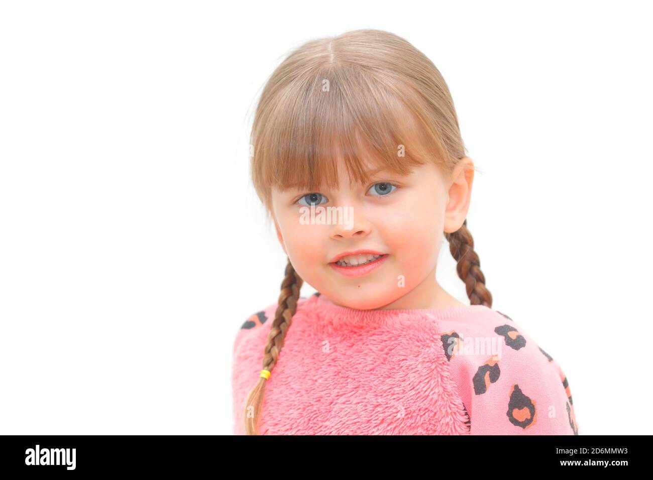 A happy 5 year old girl with pigtails Stock Photo Alamy