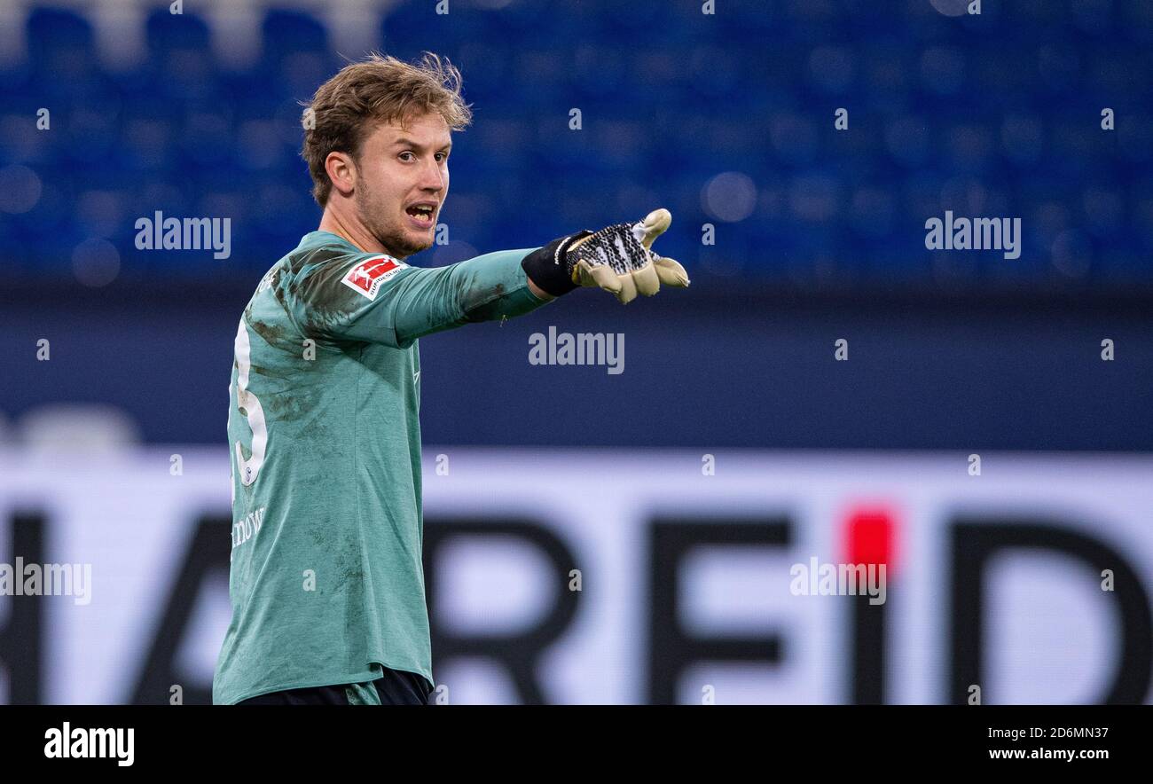 Gelsenkirchen, Germany. 18th Oct, 2020. Football: Bundesliga, FC Schalke 04 - 1st FC Union Berlin, 4th matchday in the Veltins Arena. Schalke's goalkeeper Frederik Rönnow gives instructions to his teammates. Credit: Guido Kirchner/dpa - IMPORTANT NOTE: In accordance with the regulations of the DFL Deutsche Fußball Liga and the DFB Deutscher Fußball-Bund, it is prohibited to exploit or have exploited in the stadium and/or from the game taken photographs in the form of sequence images and/or video-like photo series./dpa/Alamy Live News Stock Photo