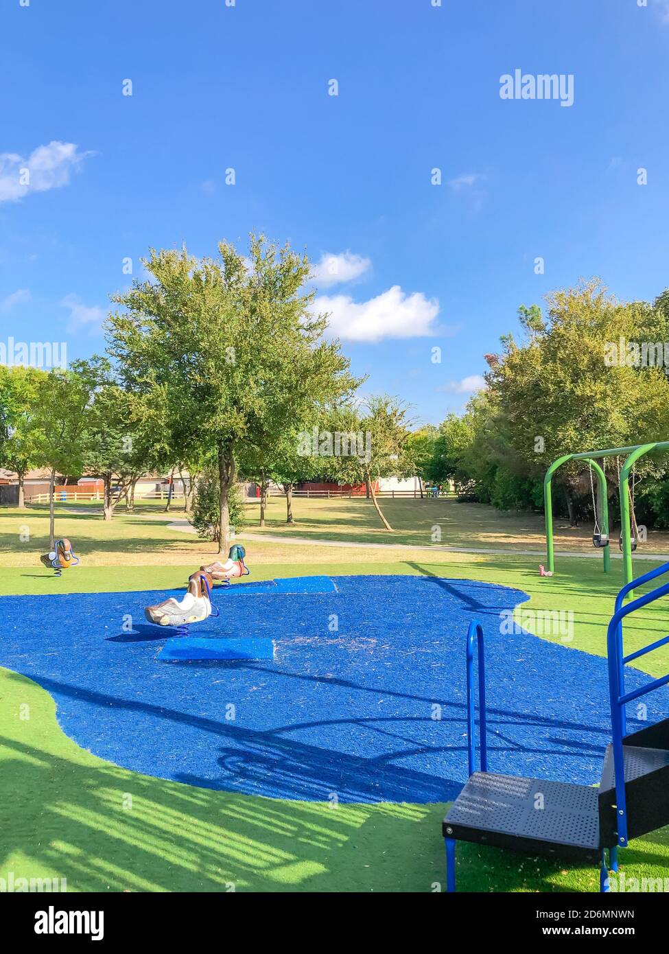 Large neighborhood playground with artificial grass in Flower Mound