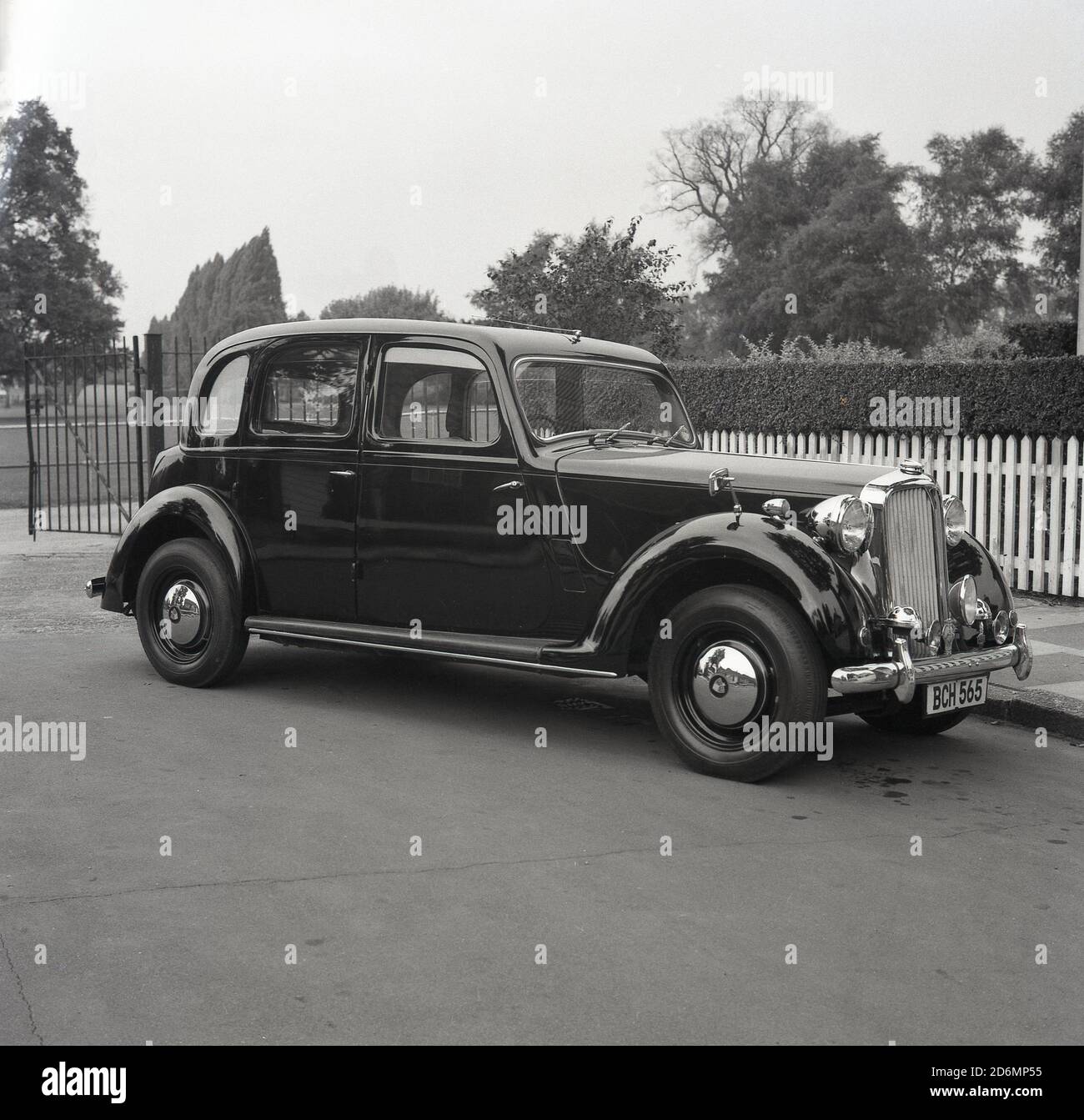 1960s, historical, an elegant Rover 16 motorcar parked at an entrance to a suburban park, South London, England, UK.  A four-door saloon with a top speed of 77 mph, British made and built between 1937 and 1940. Stock Photo