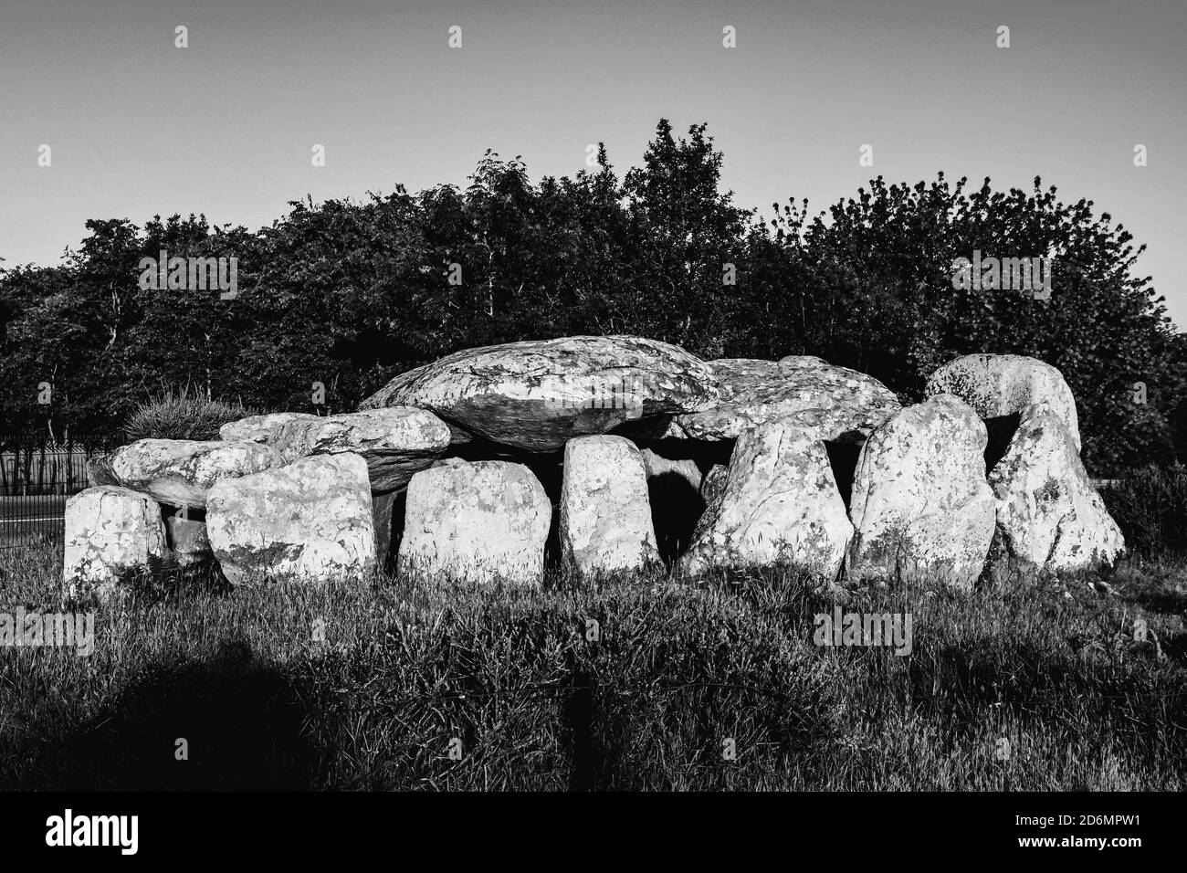 Dolmen passage grave near the Kermario alignment at Carnac, France. Black and white photograph Stock Photo