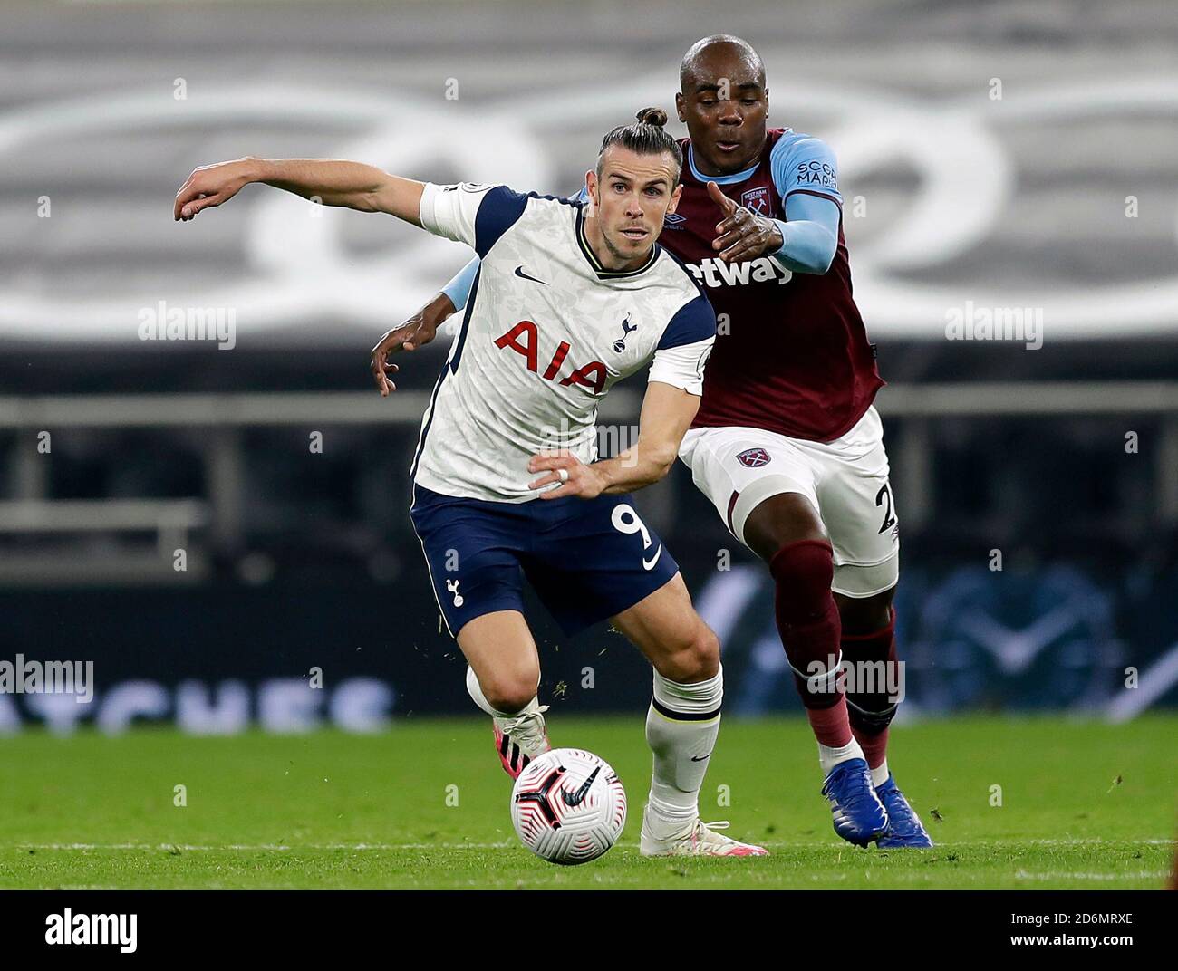 West Ham United's Angelo Ogbonna (right) and Tottenham Hotspur's Gareth Bale battle for the ball during the Premier League match at Tottenham Hotspur Stadium, London. Stock Photo