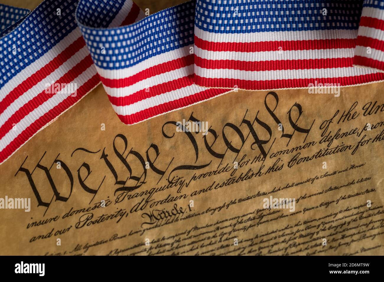 Stock photo of a copy of  the American Constitution with red, white, and blue ribbon. Stock Photo