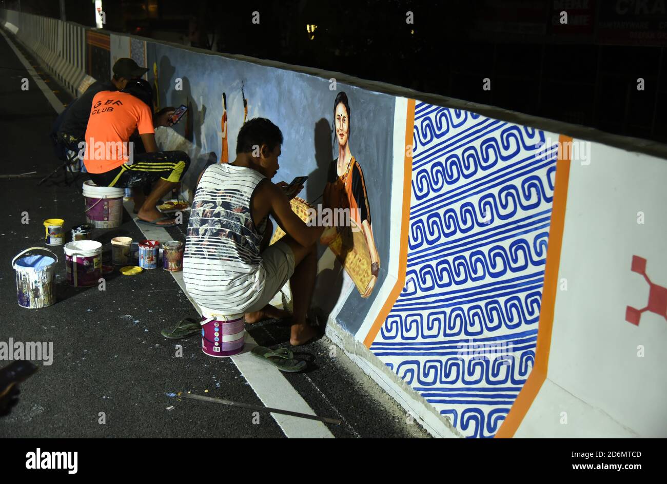 Guwahati, Assam, India. 18th Oct, 2020. Artist paint mural in a newly constructed fly over ahead