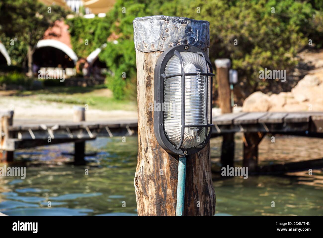 Lamp light with Illumination on the concrete floor for lighting on pier and fishing boat, ferry, yacht Stock Photo