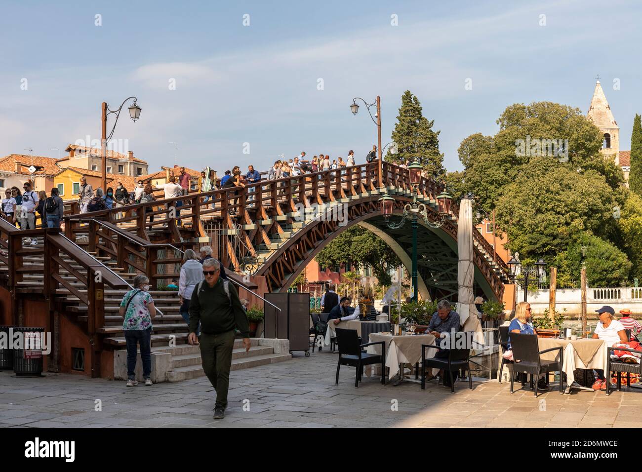 Restaurant at the base of The Ponte dell Accademia (Accademia Bridge) over the Grand Canal, San Marco, Venice, Italy Stock Photo