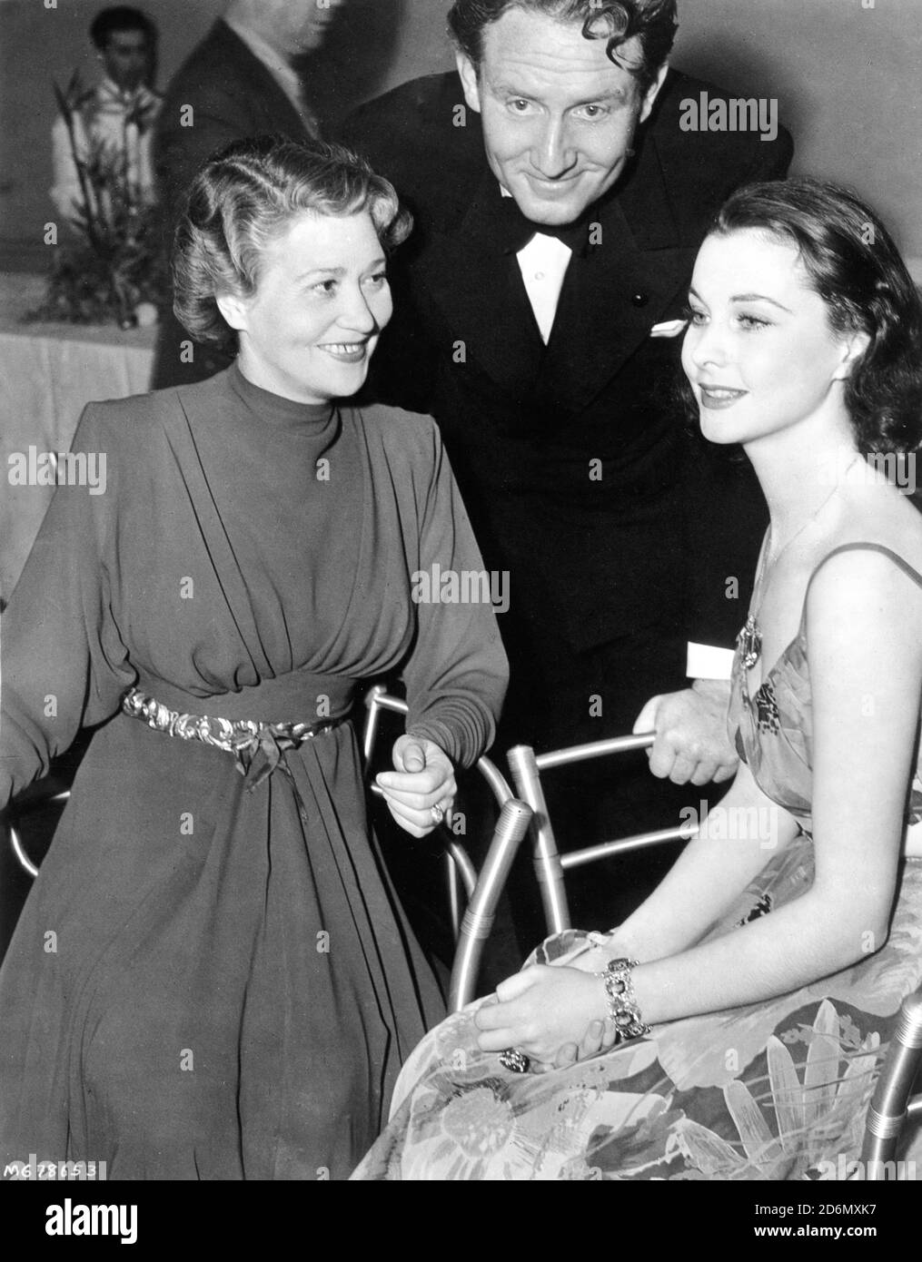 FAY BAINTER and SPENCER TRACY Oscar Winners from the previous year with new Best Actress Oscar winner VIVIEN LEIGH at the Academy Awards Banquet at the Cocoanut Grove on February 29th 1940 in Hollywood where GONE WITH THE WIND won 8 Oscars Stock Photo