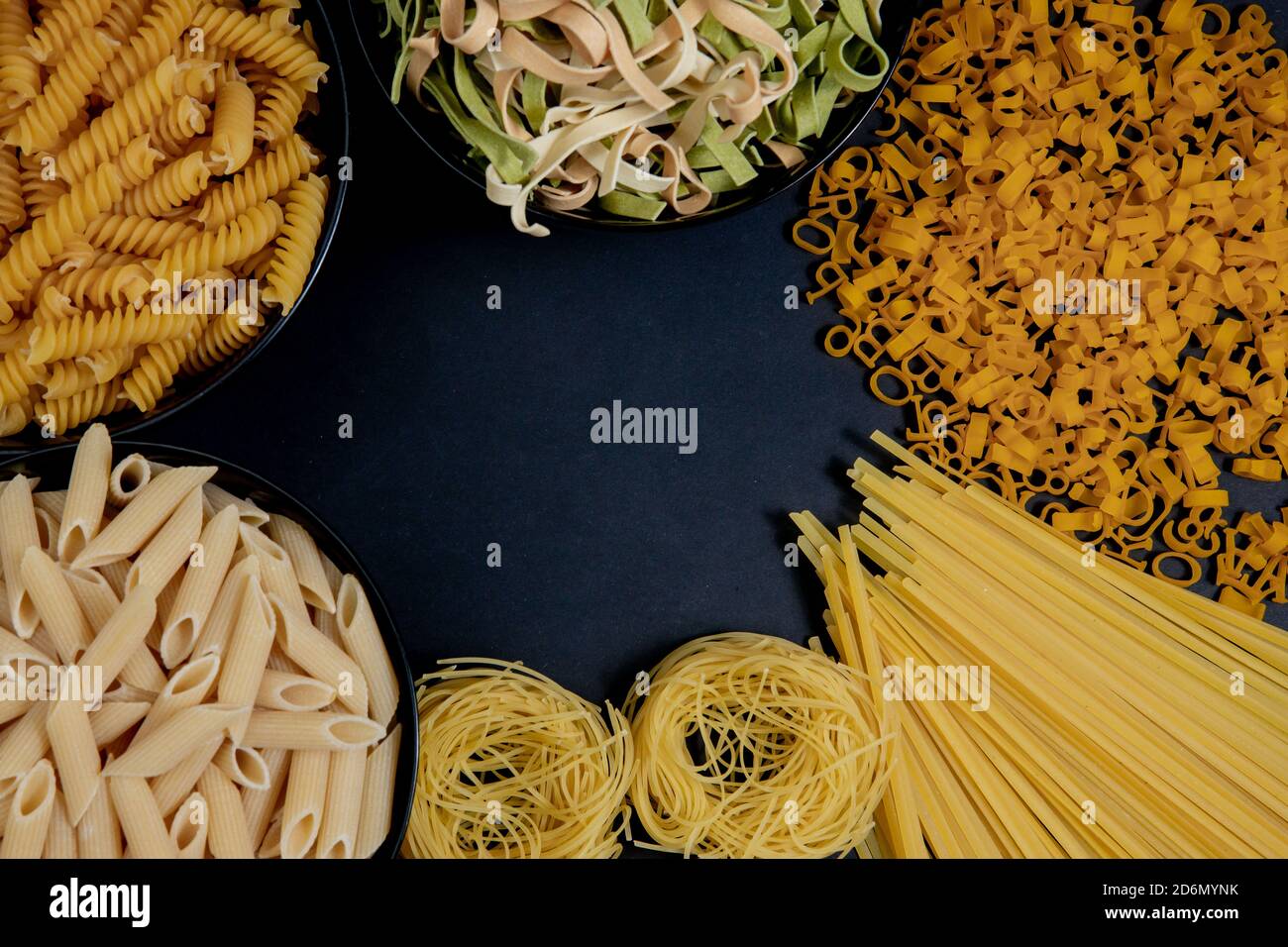 Assortment Of Different Types Of Pasta Dry On Black Background Stock 