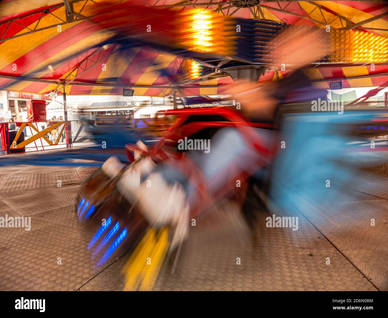 Spin cycle on a spinning waltzer in fun park Stock Photo