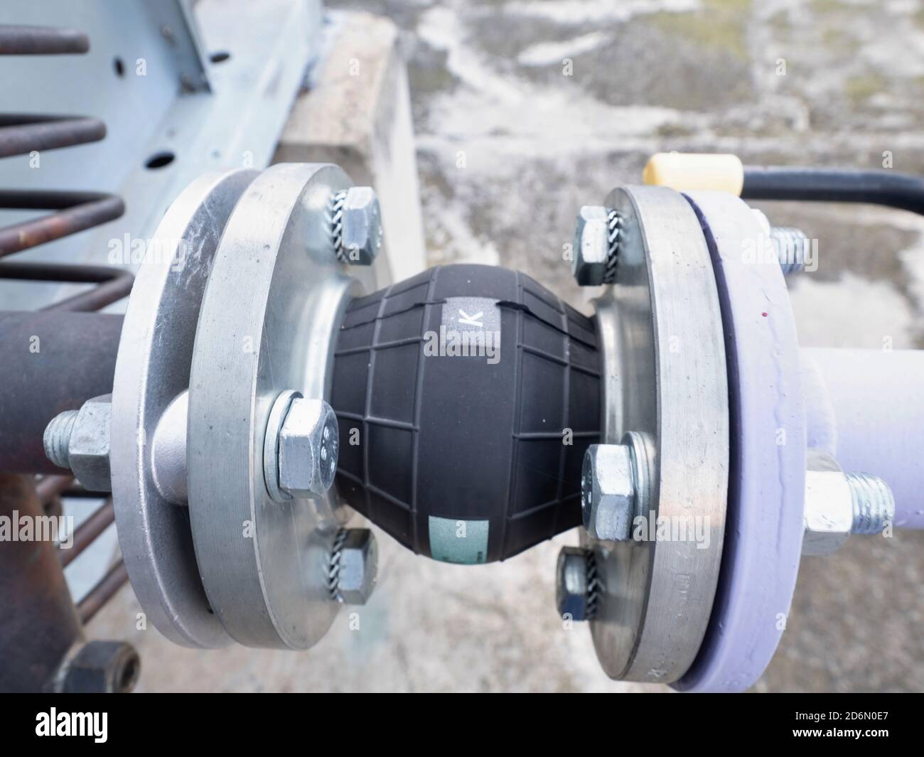 Condenser water pipelines with pressure gauge and rubber vibration damper. Pipes and red valves