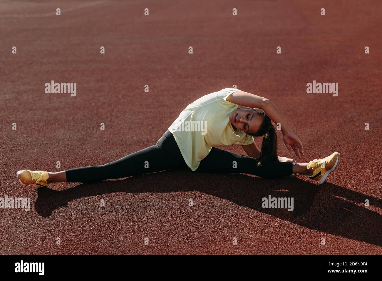 Active woman doing aerobic exercises in twine position Stock Photo Alamy