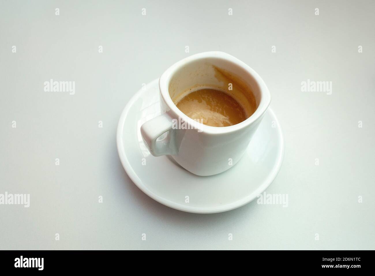 Isolated Shot Of A Half Full Cup Of Coffee With Milk On White Background Stock Photo Alamy