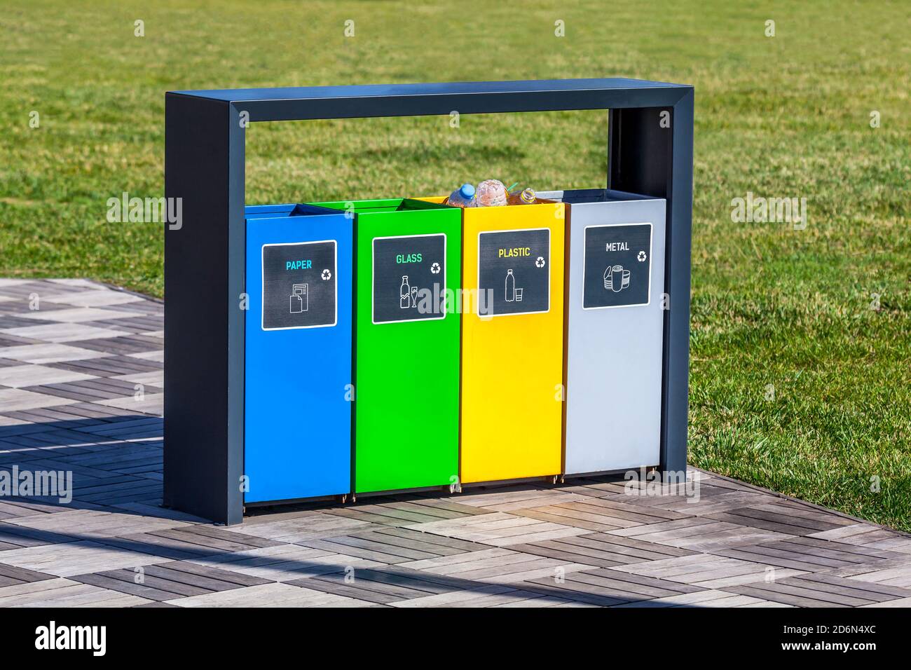 Colorful metal recycle bins in the park Stock Photo