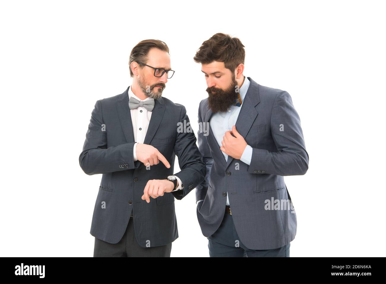 Punctuality concept. Business people formal clothes checking time. Time management discipline. Improve punctuality. Man mature boss with clock care about time efficiency. Coworkers discipline. Stock Photo