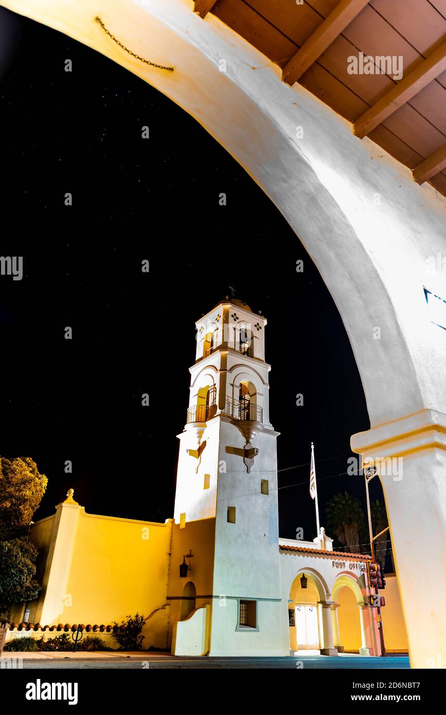 Portion of architectural arch frames the Ojai tower against the night sky twinkling with constellation stars. Stock Photo