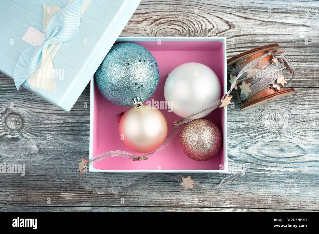 Christmas toys-balls in a blue and pink box Stock Photo - Alamy
