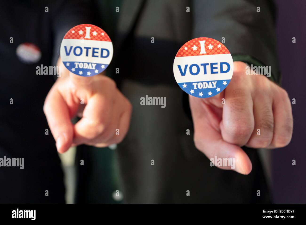 Man and woman with I Voted Today sticker on finger Stock Photo - Alamy