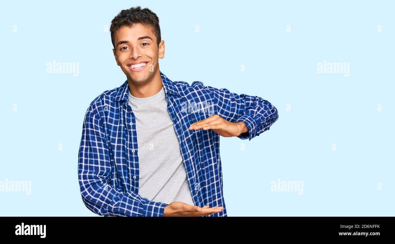 Young handsome african american man wearing casual clothes gesturing ...