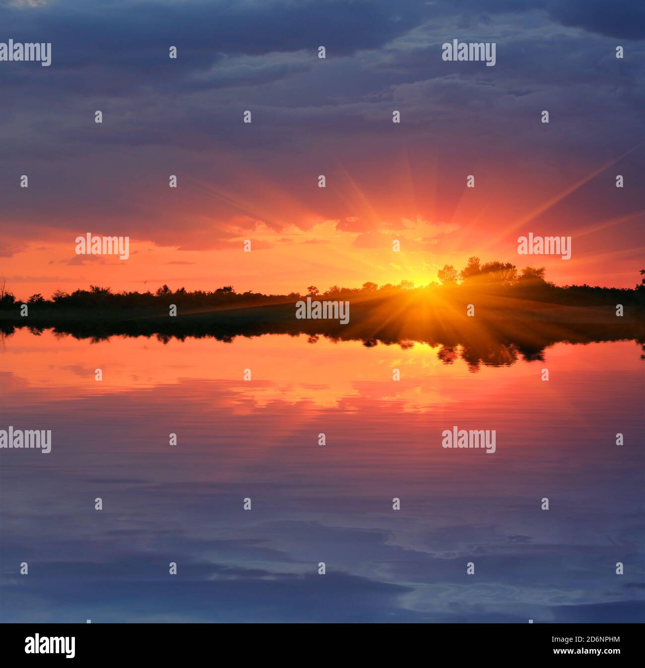 nice sunset over water surface Stock Photo - Alamy