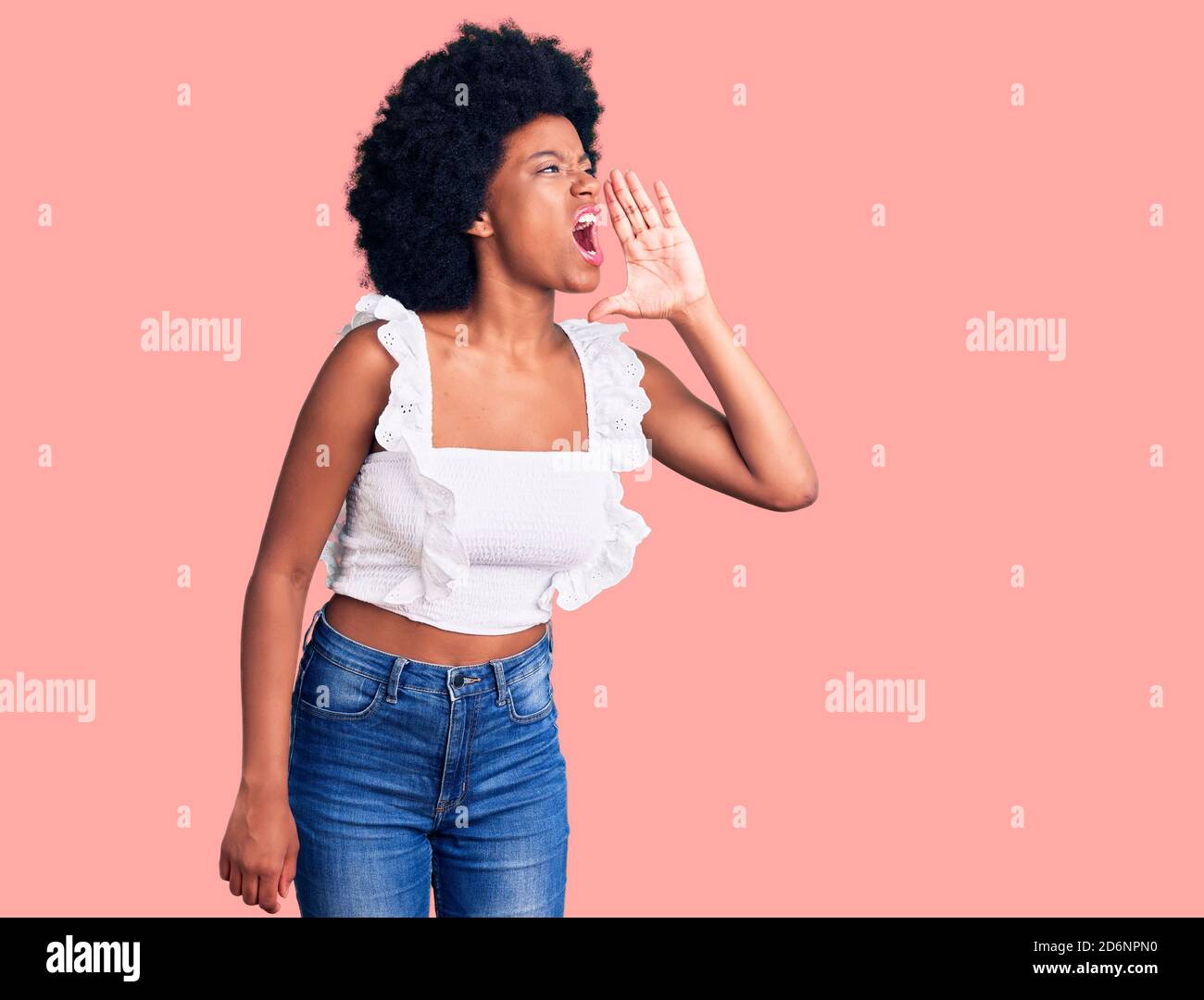 Young african american woman wearing casual clothes shouting and ...