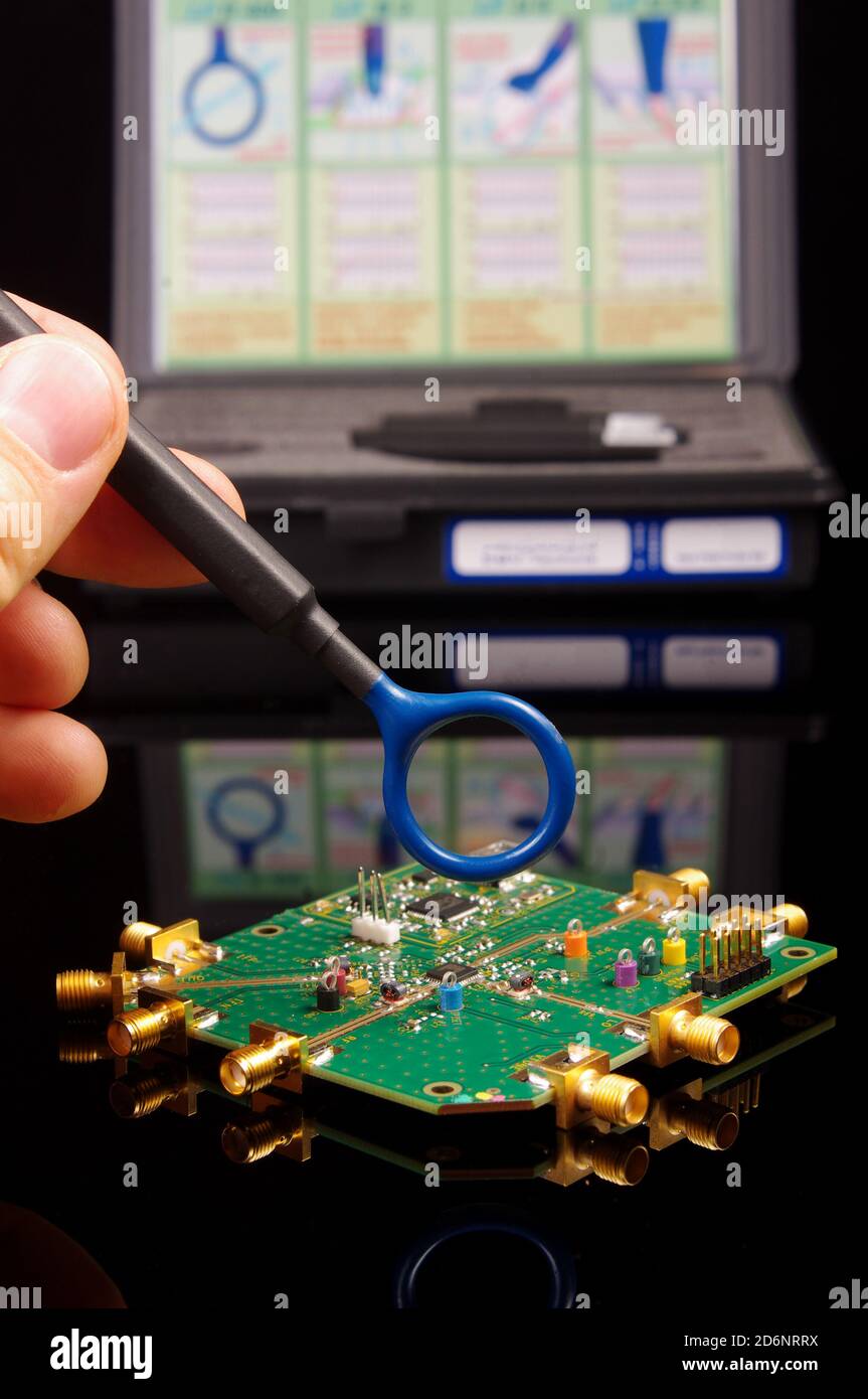 compatibility (EMC) engineer holding near